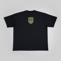 Black t-shirt with a small logo on the back against a light gray background